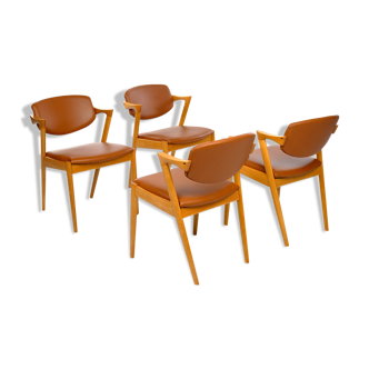 Four Kai Kristiansen oak chairs with new leather upholstery