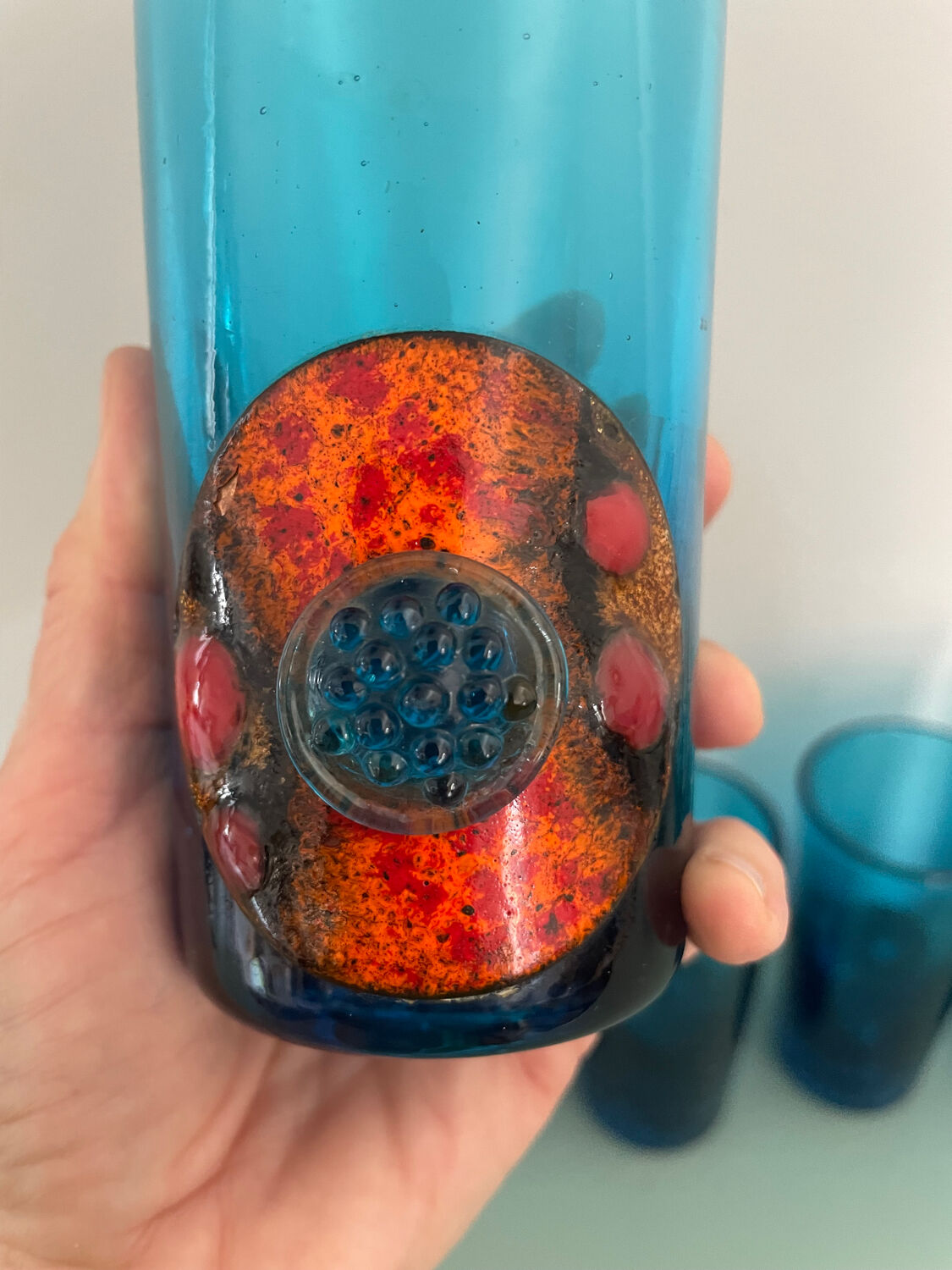 Six blue blown glass and enamel on copper glasses.