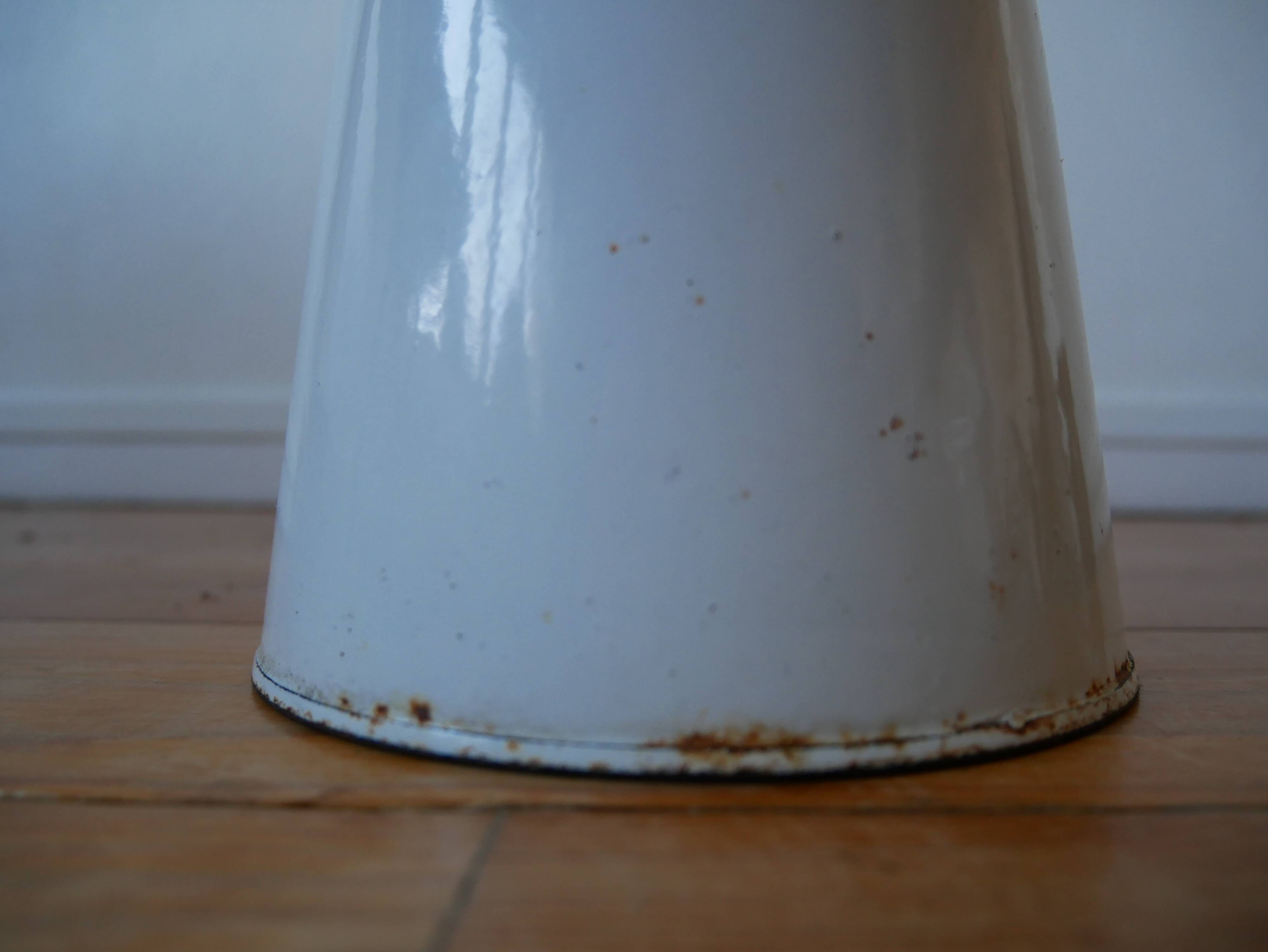 White enamelled metal broc