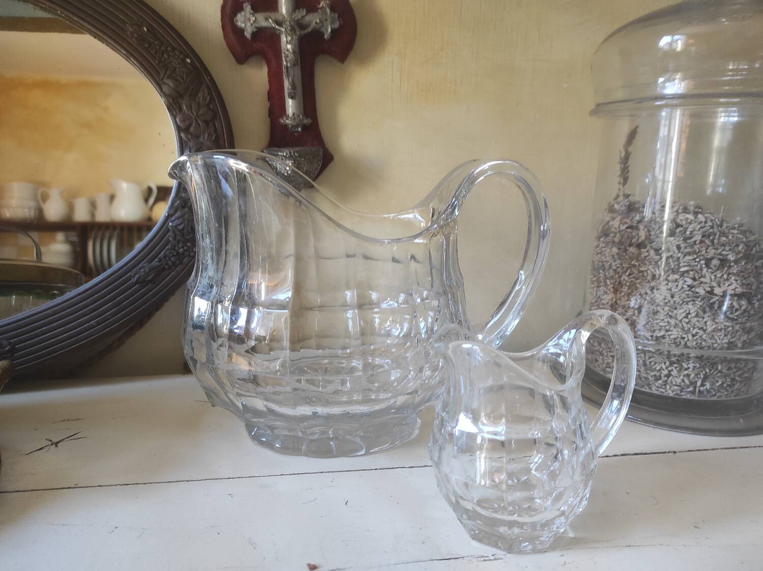 2 antique glass pitchers