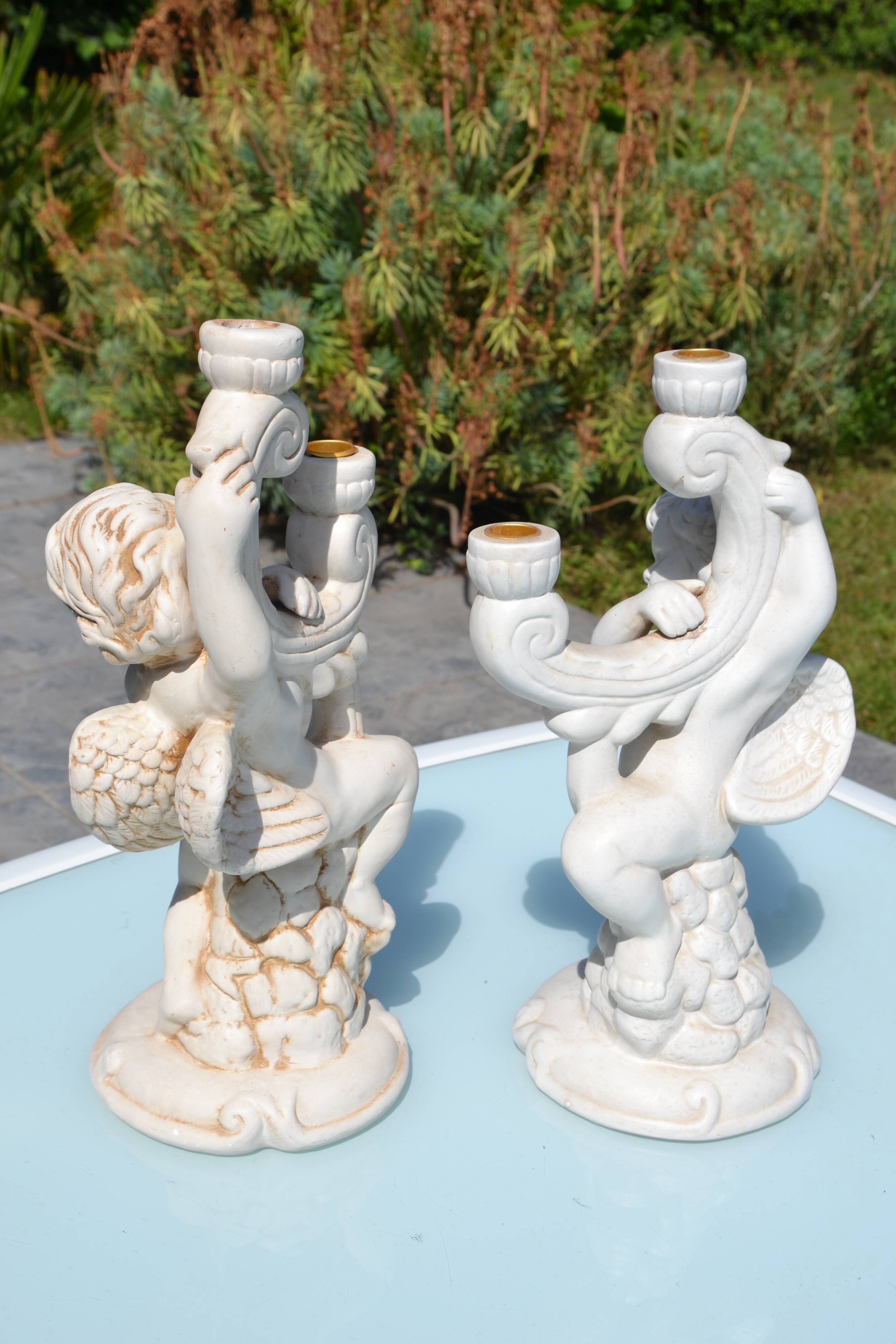 Pair of "cherub" candle holders in plaster