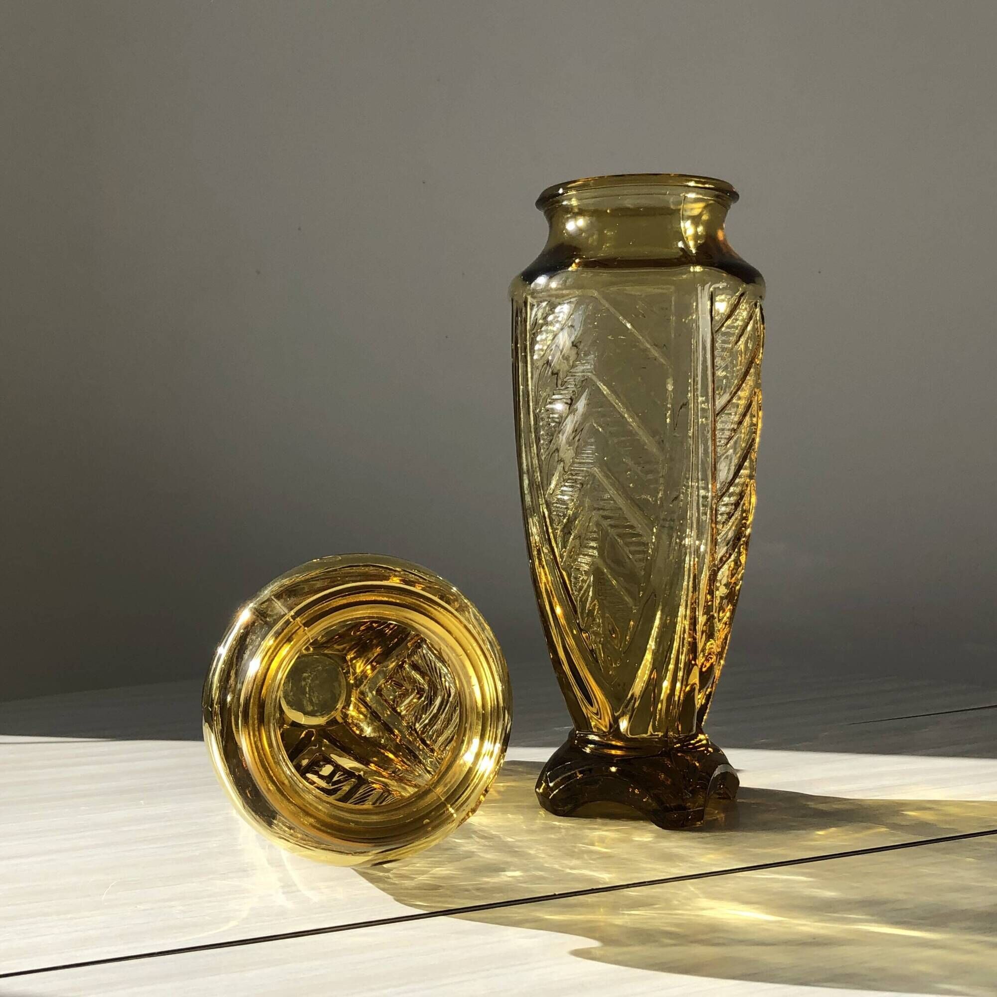 Duo of art deco vases in yellow glass with scroll patterns