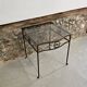 Petite table d'appoint en fer forgé et verre fumé