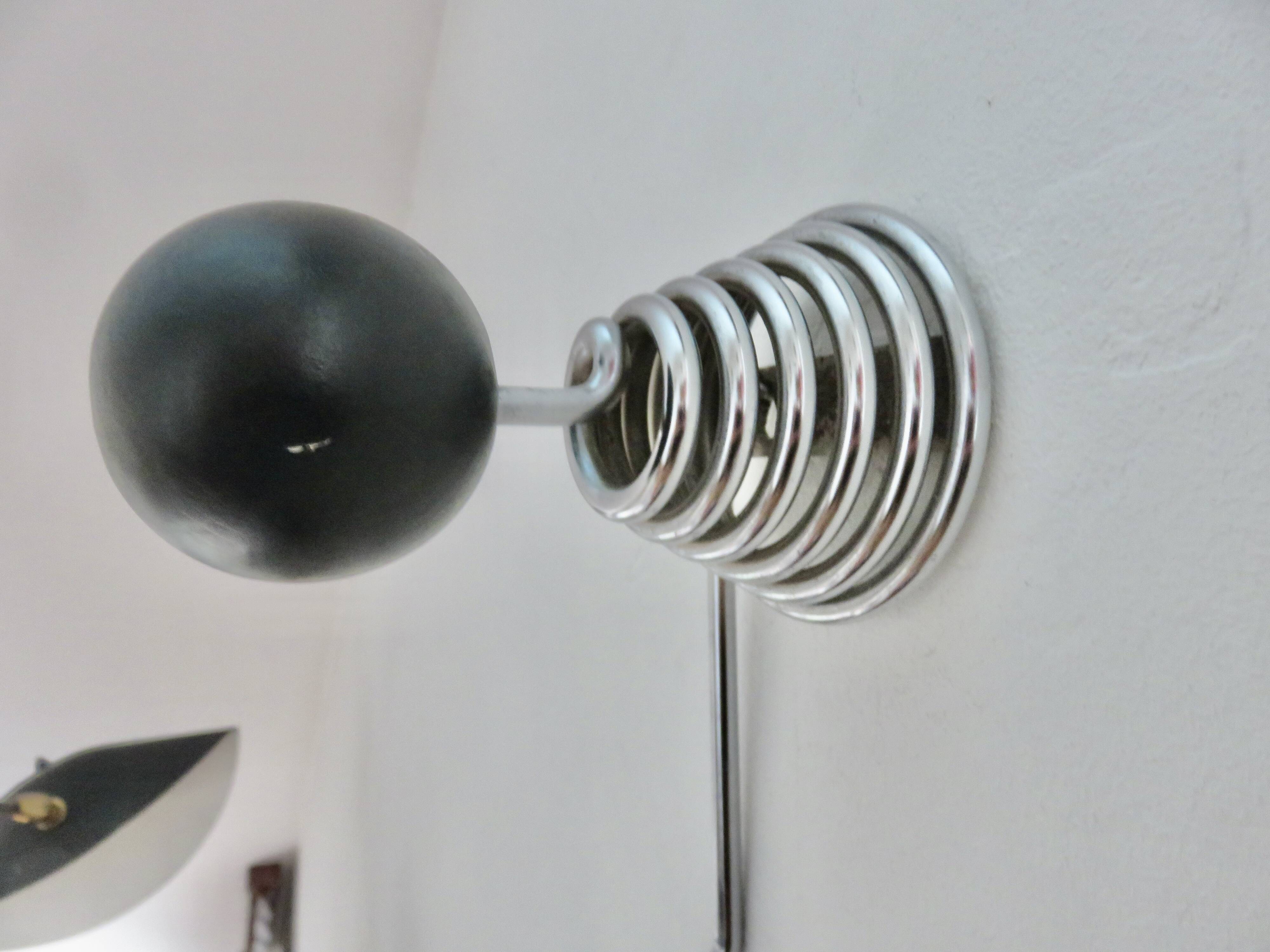 "Streamline" wall coat rack in chromed metal and black lacquered wood, 1970.