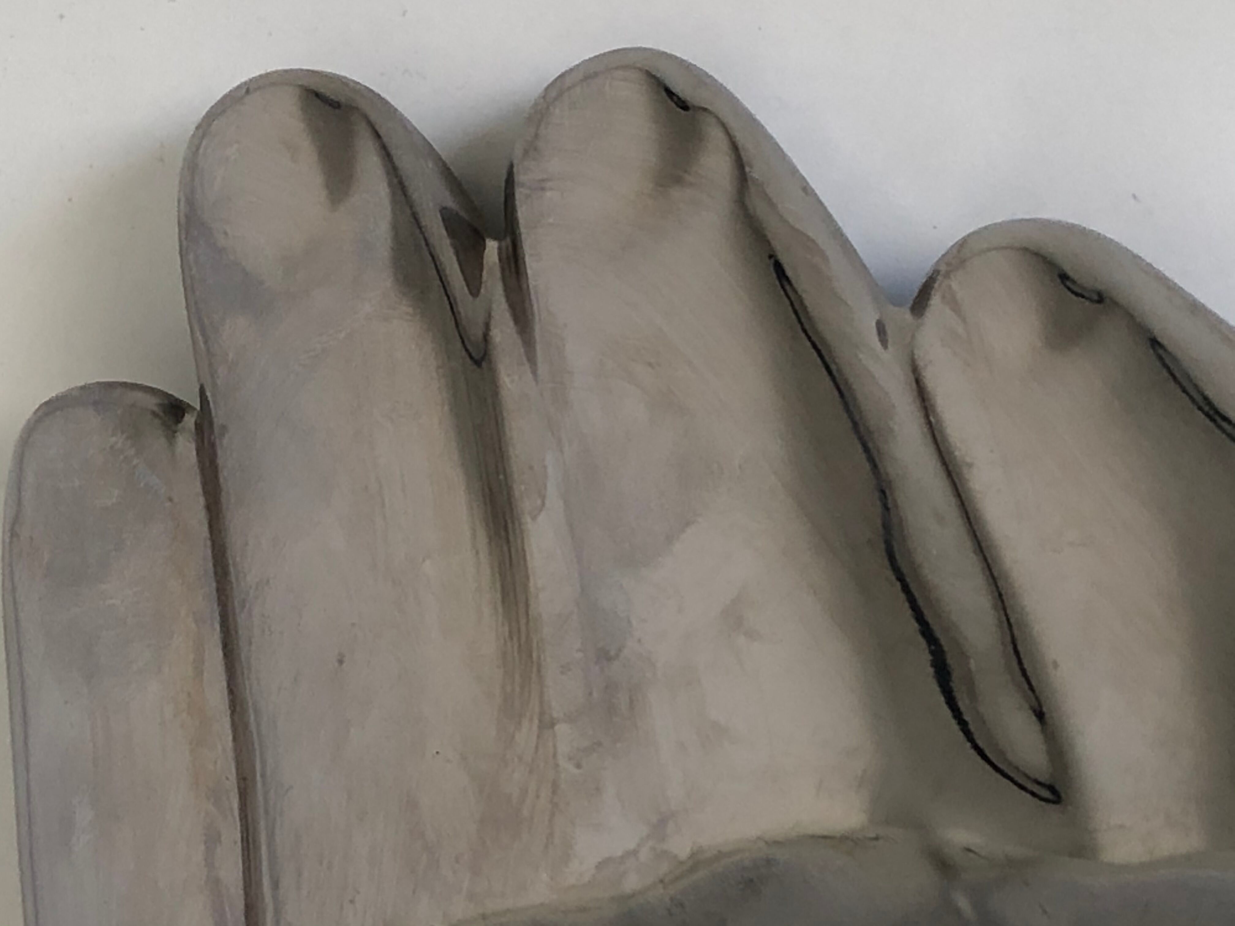Empty silver chromed ceramic pocket in the shape of a large hand, 1980