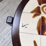 Round ceramic coffee table with “rooster” motif by Dan