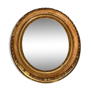 Miroir ovale en bois et stuc doré