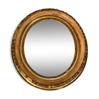 Miroir ovale en bois et stuc doré