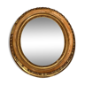 Miroir ovale en bois et stuc doré