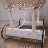 Wicker and painted wood baby cradle