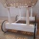 Wicker and painted wood baby cradle