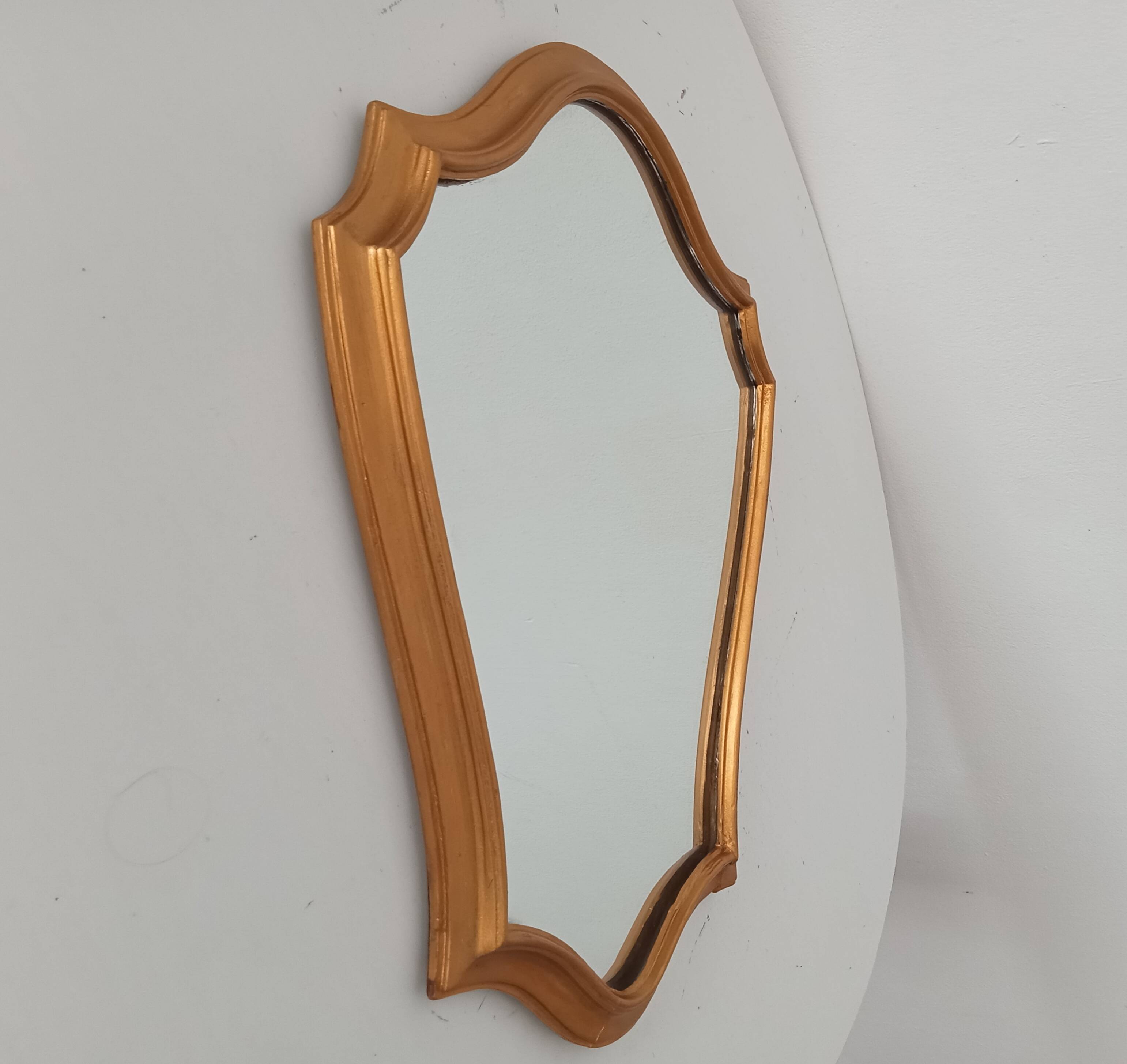 Vintage baroque mirror in gilded wood