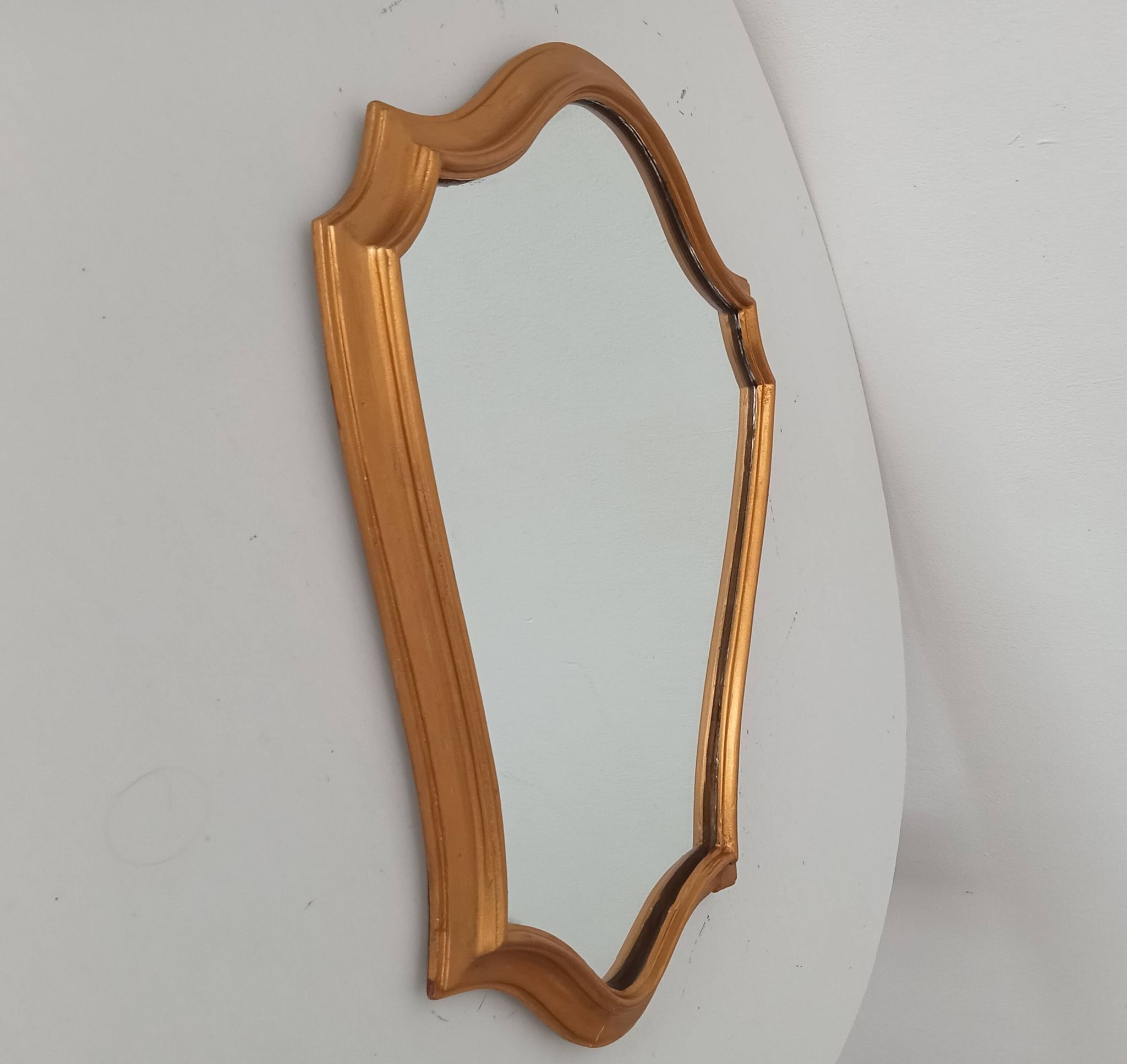 Vintage baroque mirror in gilded wood