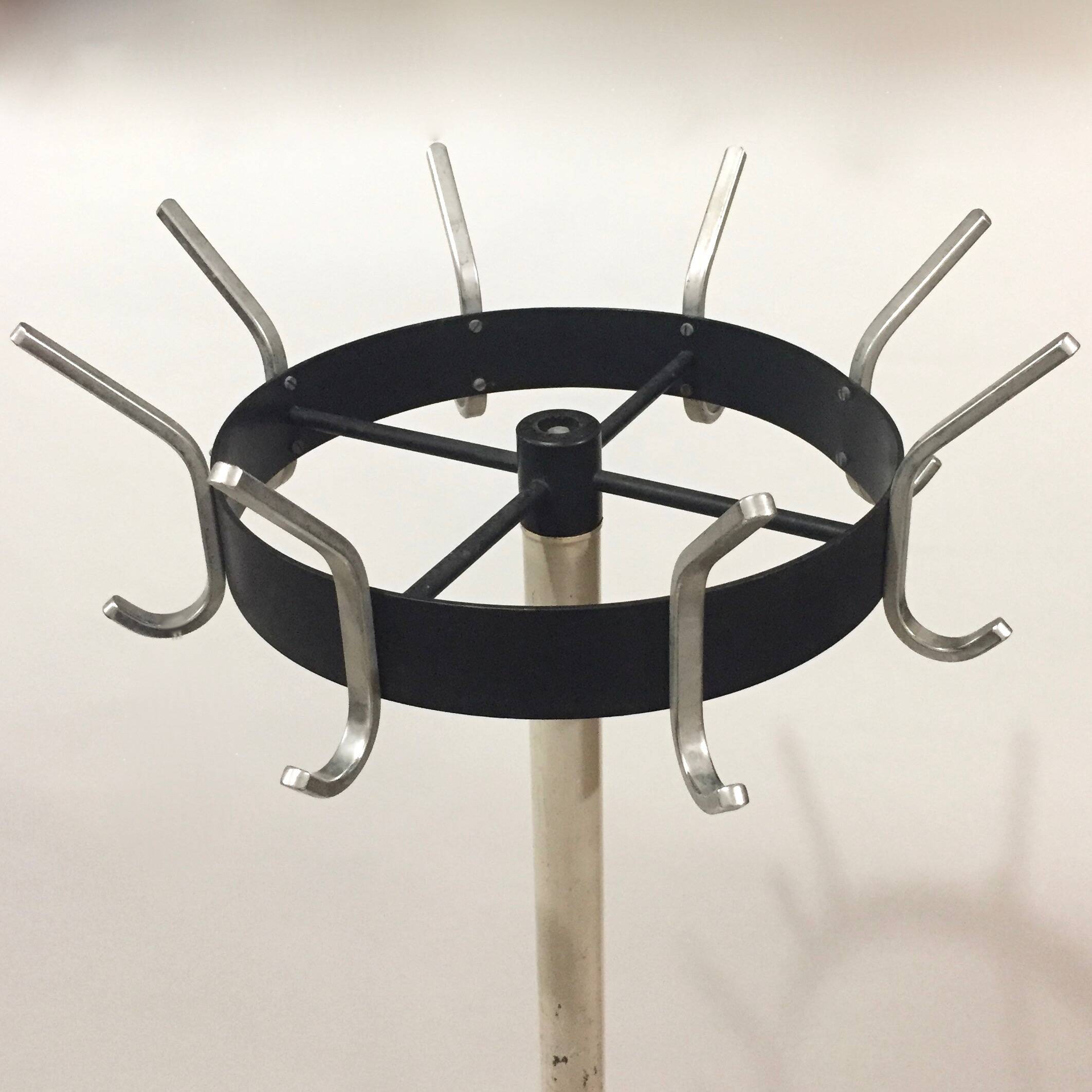 Coat rack on turnstile stand