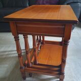Nesting tables in solid cherry wood held together by slides