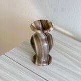 Natural stone vase with marbled patterns.