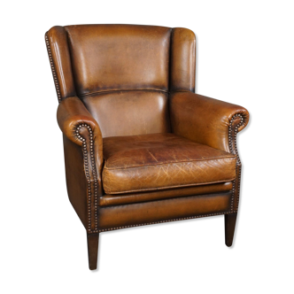 Patinated sheepskin armchair