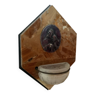 Old marble holy water font