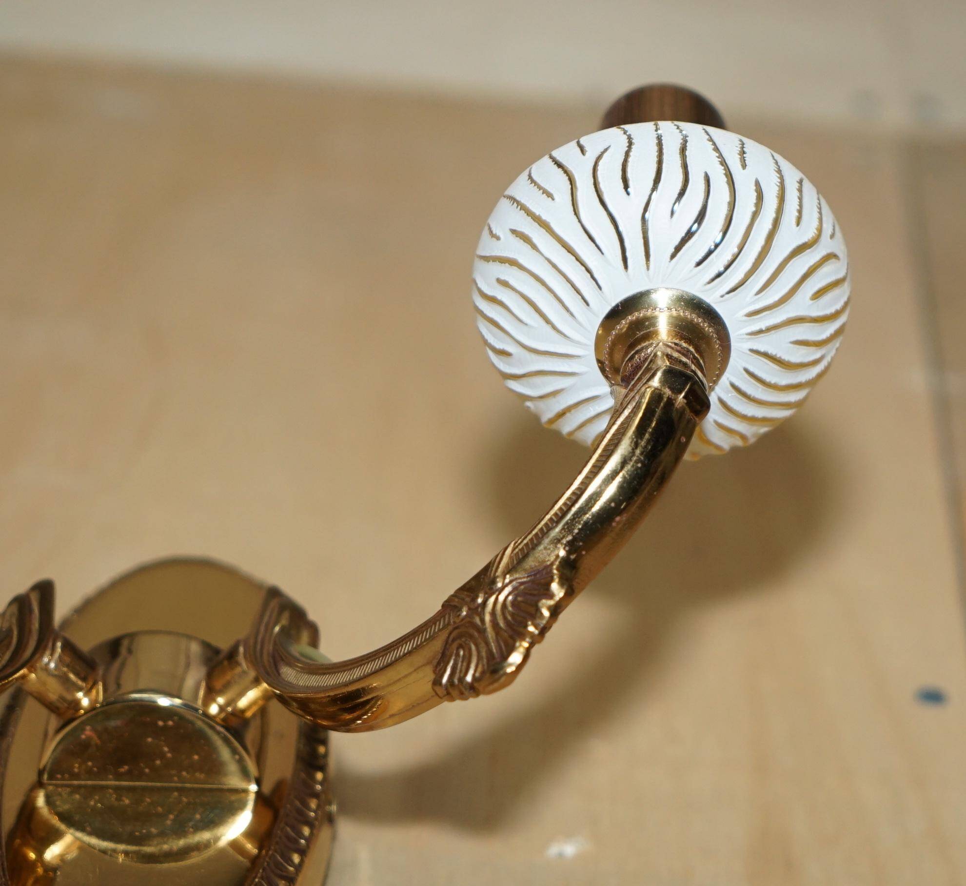 Reccagni wall light pair in brass and frosted glass.