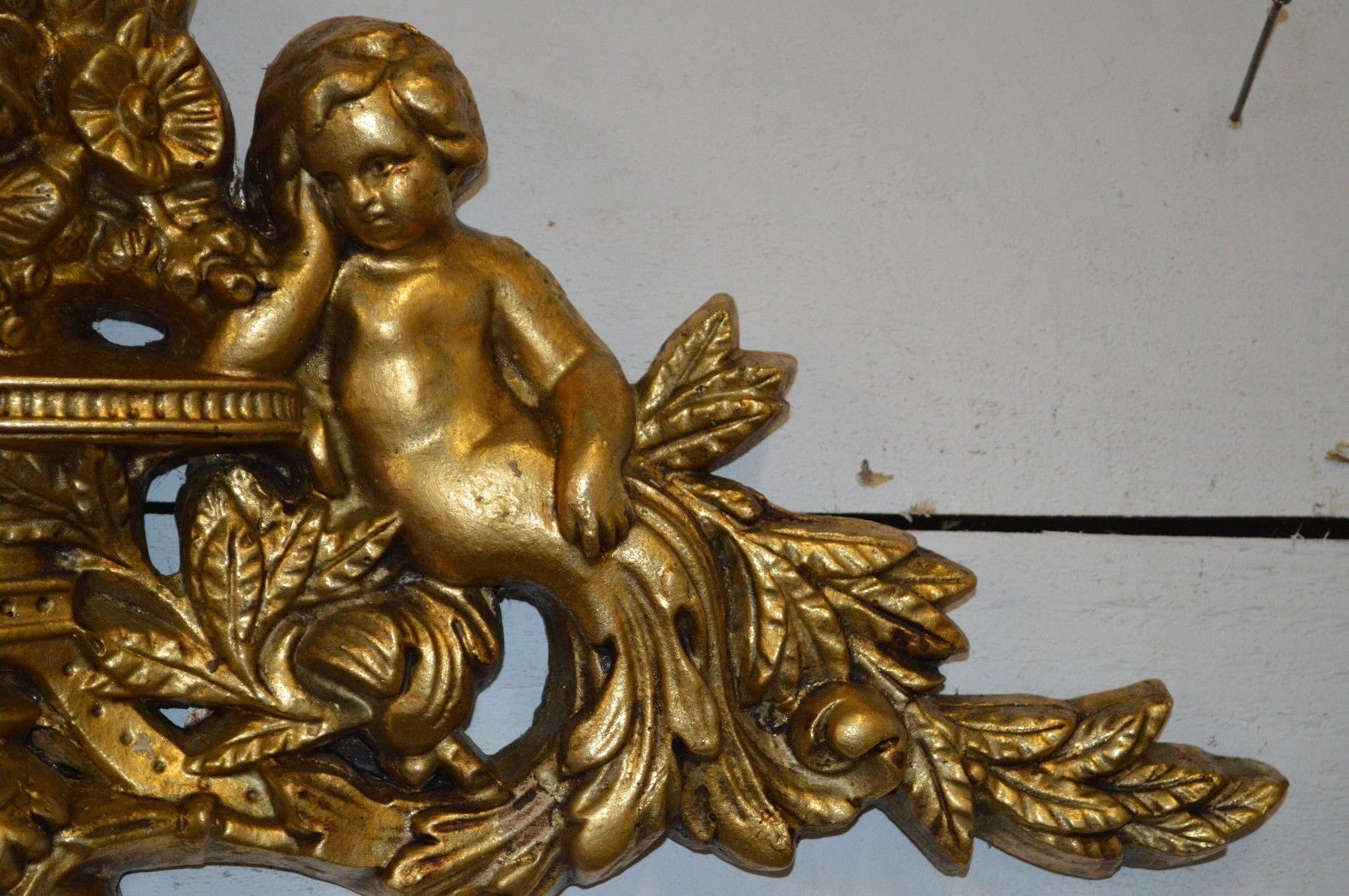 Pediment with patinated characters golden