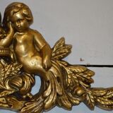 Pediment with patinated characters golden