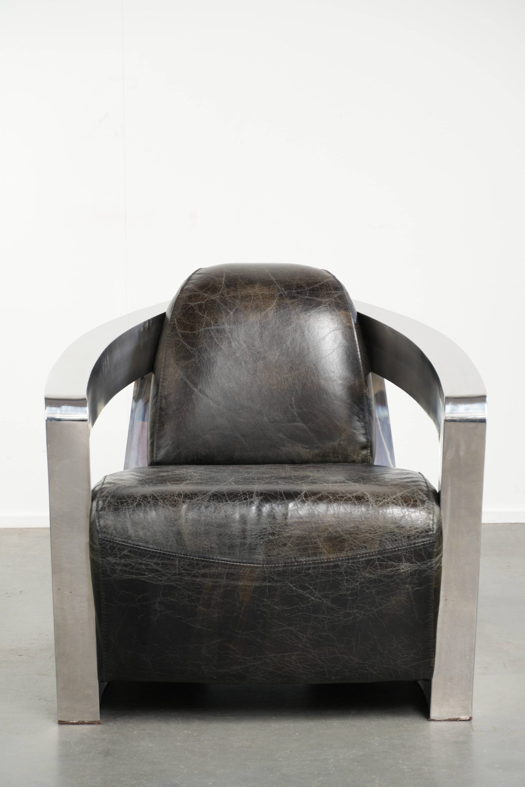 Industrial Aviator design armchair in cowhide finished with aluminium