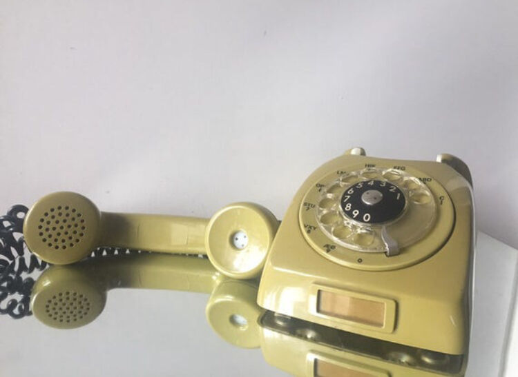 Vintage mustard green rotary telephone