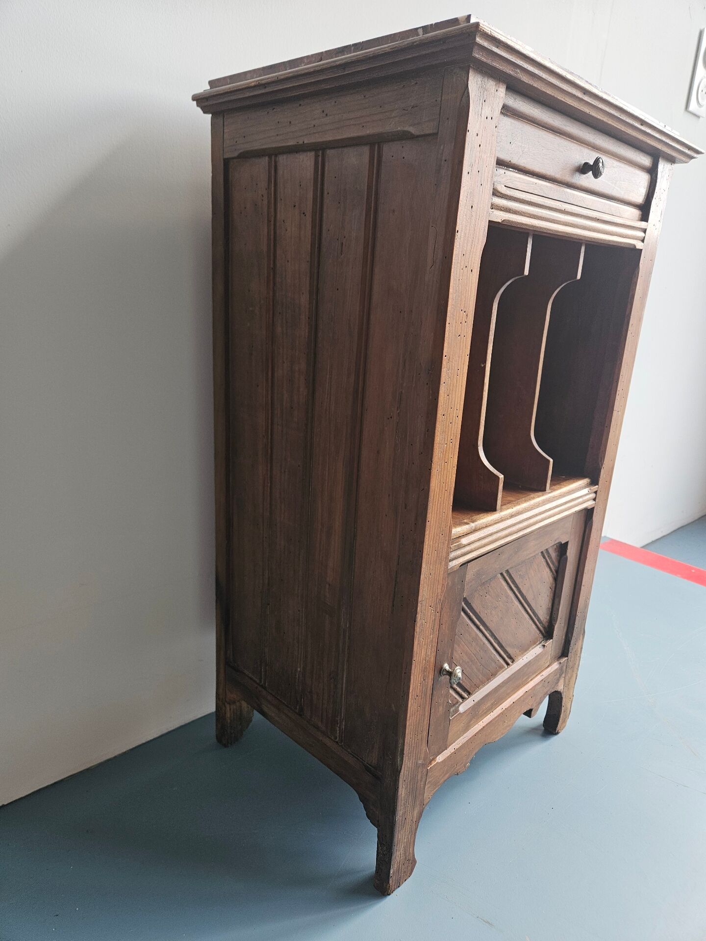Wooden bedside table with book storage