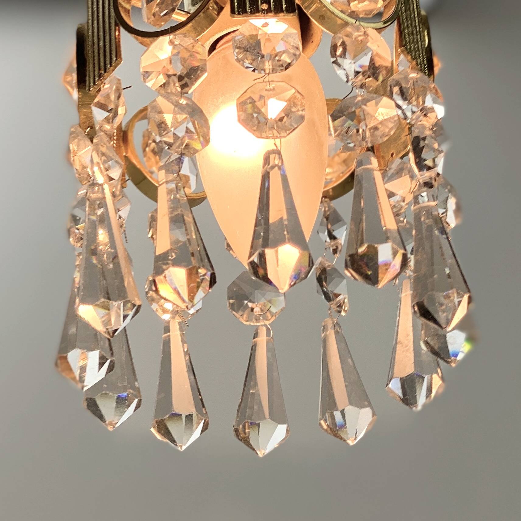 Two gold-plated brass and crystal pendant lights, by Palwa, 1960s design, Hollywood Regency.