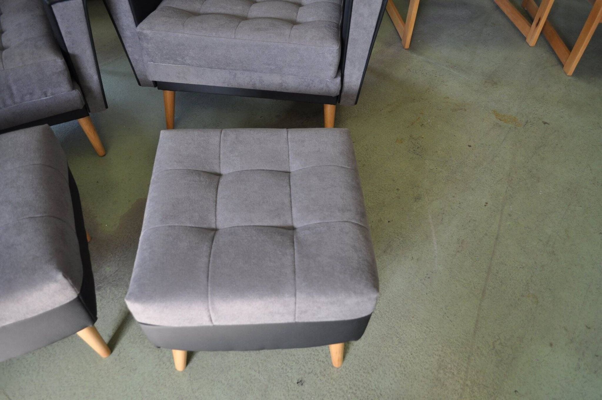 Set of 2 mid-century grey and black ottomans in fabric and eco-leather, wooden legs.