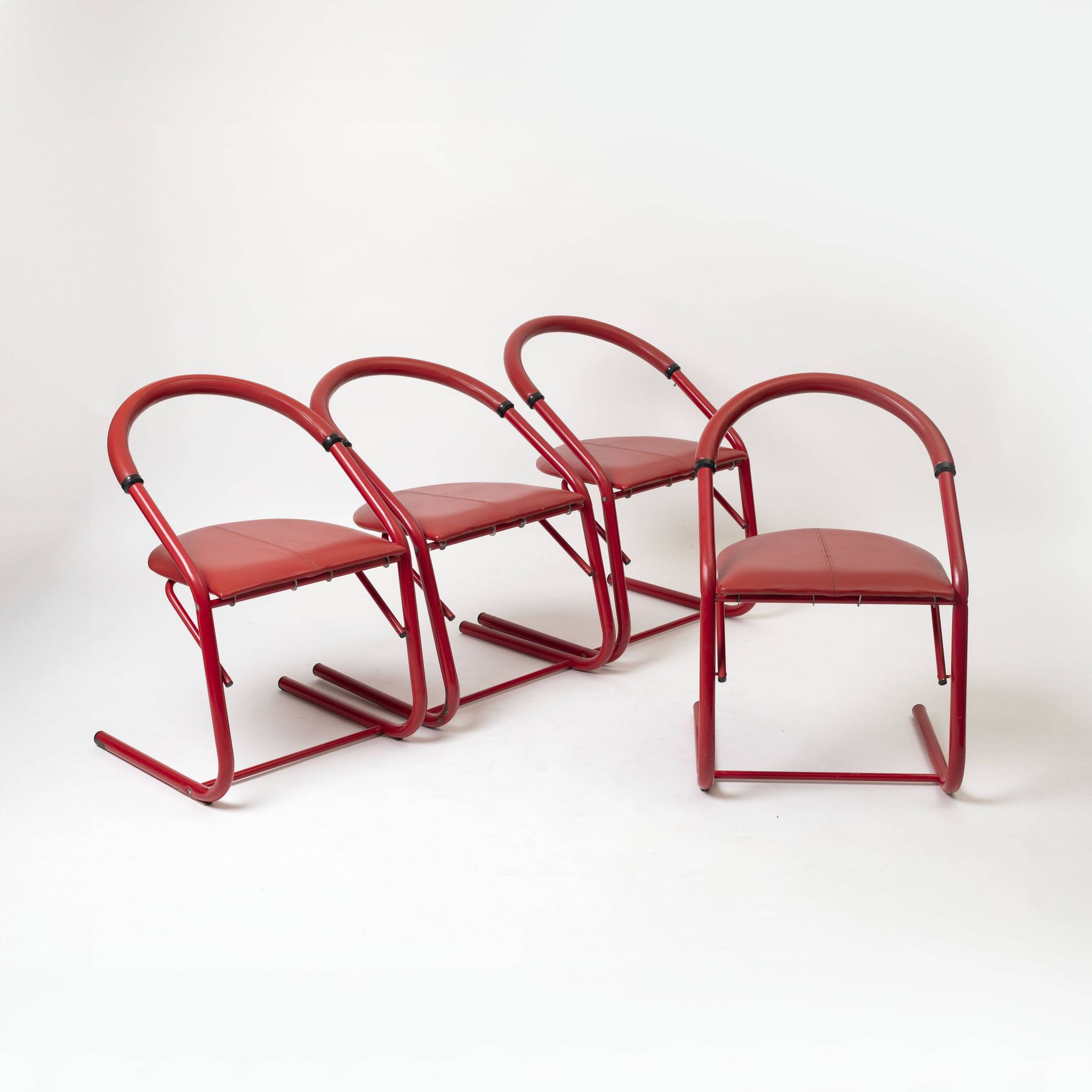 Set of 4 postmodern dining chairs in red lacquered metal and leatherette, italy, 1980s
