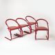 Set of 4 postmodern dining chairs in red lacquered metal and leatherette, italy, 1980s