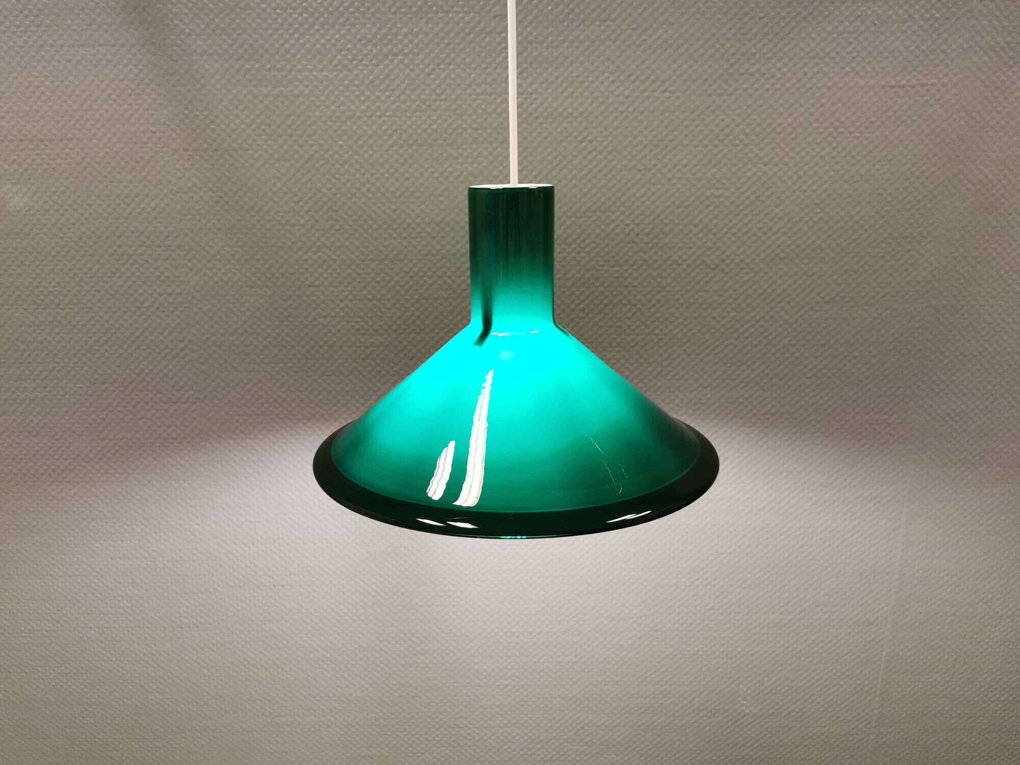 Green glass hanging lamp in double layer glass. Designed by Michael Bang for Holmegaard Denmark 1972