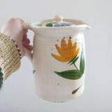 Old earthenware pitcher with its lid