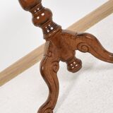 Pedestal table or side table, carved wooden legs, inlaid veneer on the top.