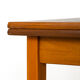 Scandinavian table with sliding panels.