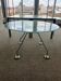 Nomos table by Norman Foster, glass and aluminium.