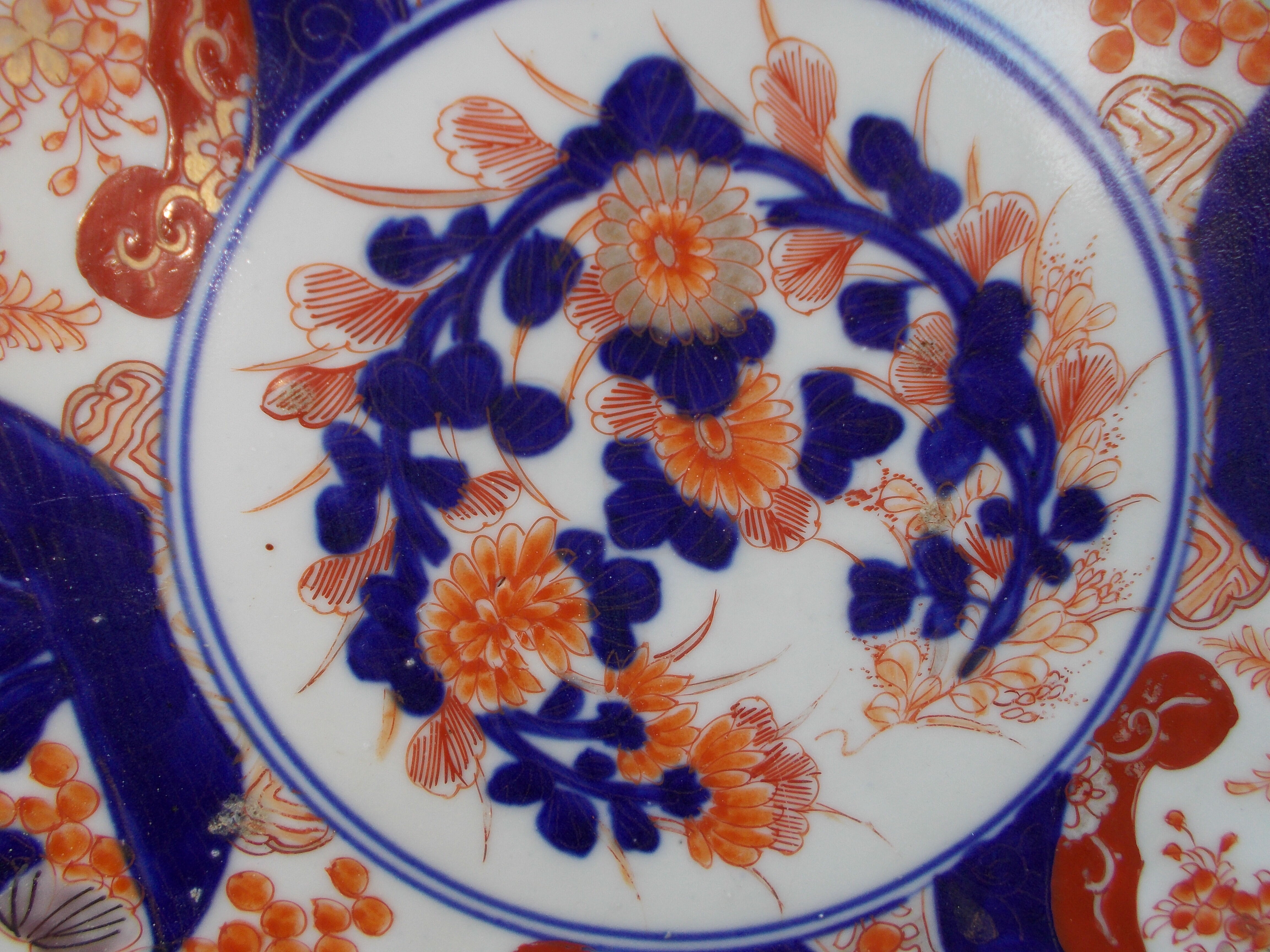 Ancient round porcelain dish from Japan Imari