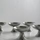 6 silver-plated metal bowls.