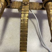 Spanish brutalist wall light in gilded wrought iron.