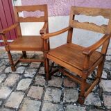Pair of vintage oak armchairs with geometric design.