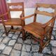 Pair of vintage oak armchairs with geometric design.