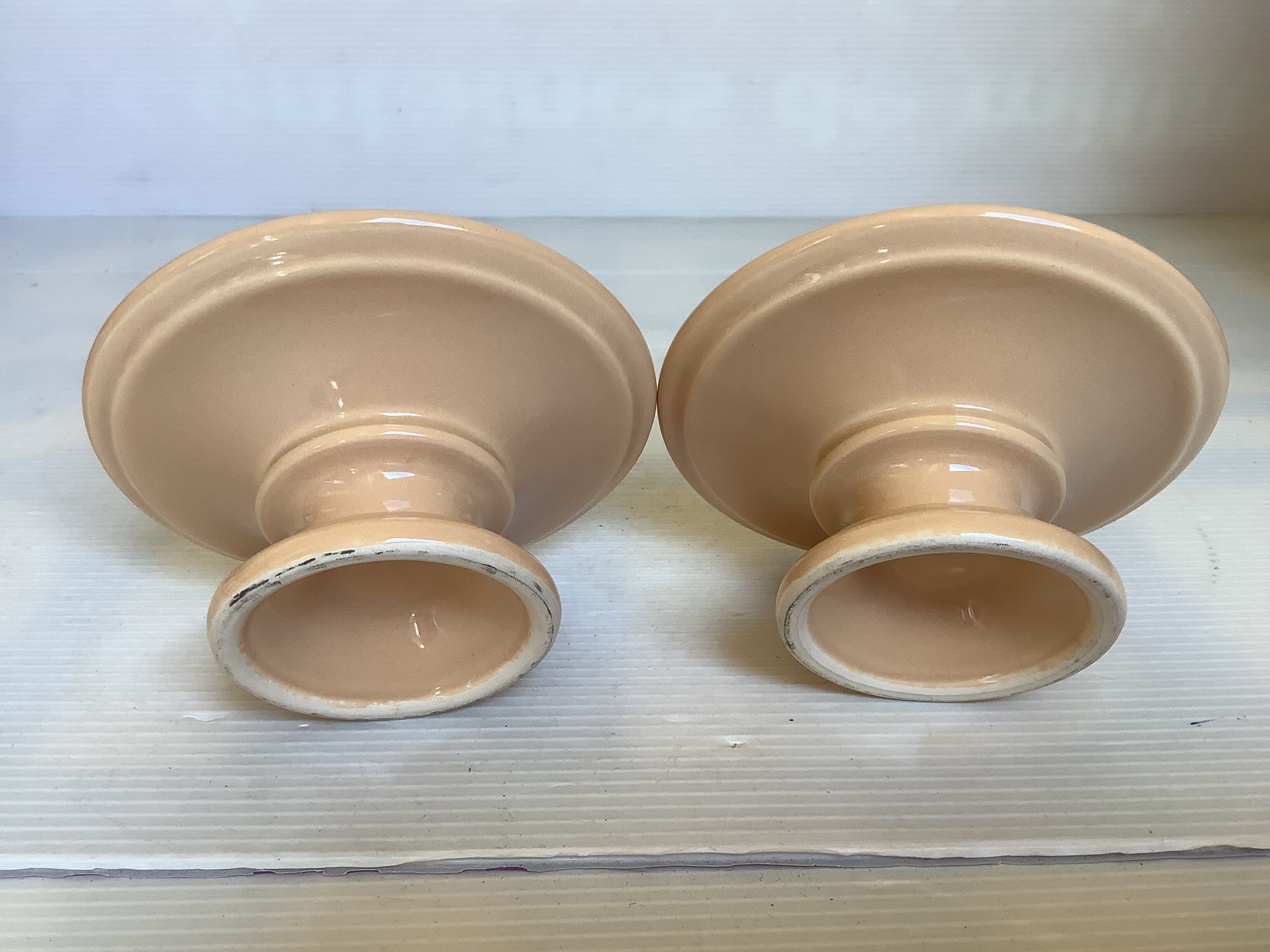 Pair of beige candlesticks