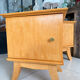 Vintage bedside table with tapered legs