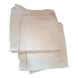 2 pillowcases with handmade lettering and day surround.