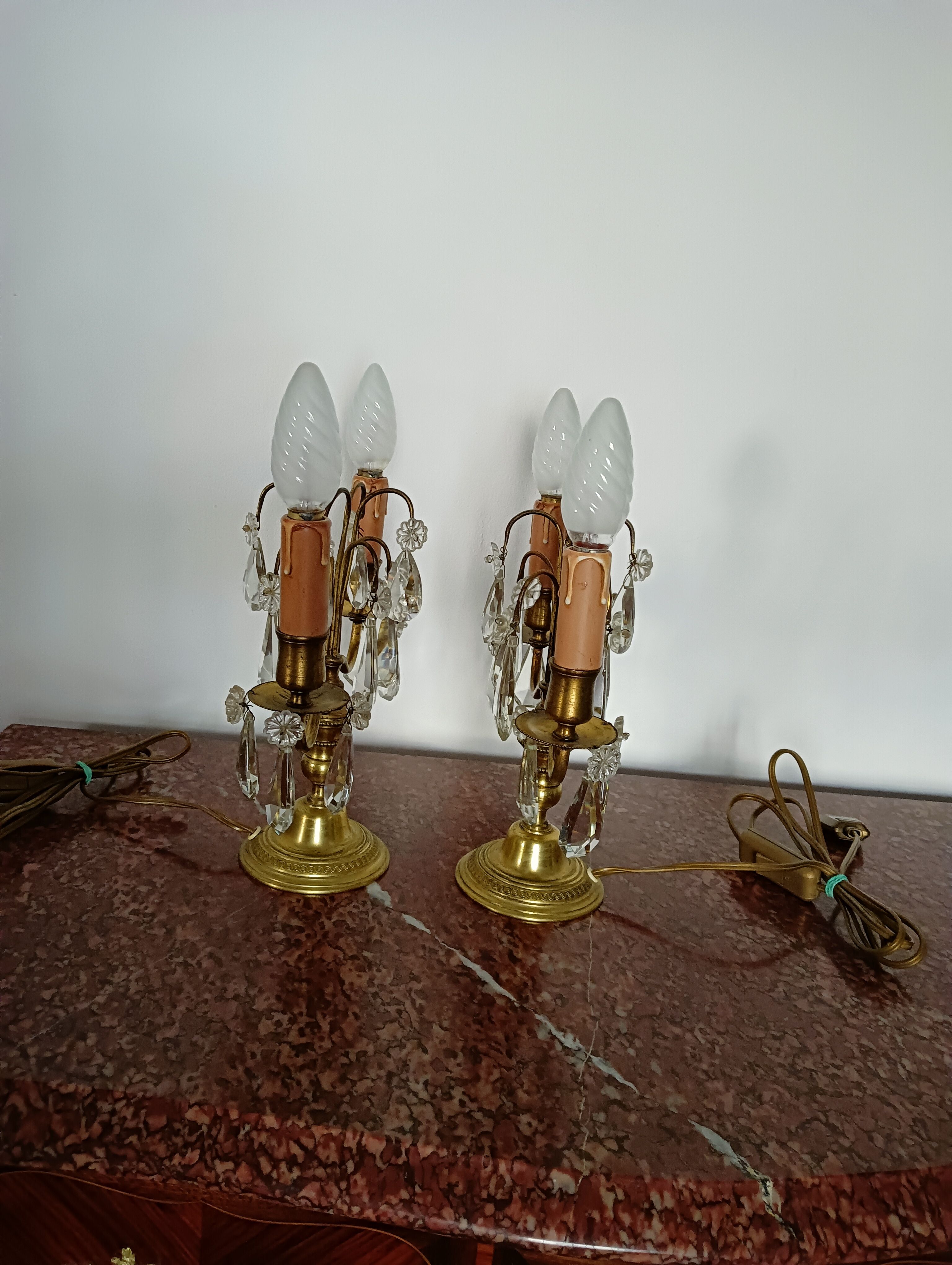 Pair of bronze girandoles with crystal pendants, two arms of lights.