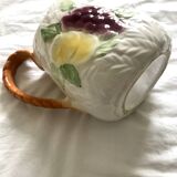 Antique barbotine pitcher with fruit decoration