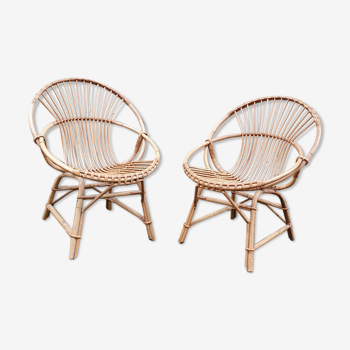 Paire de fauteuils coquille en rotin vintage