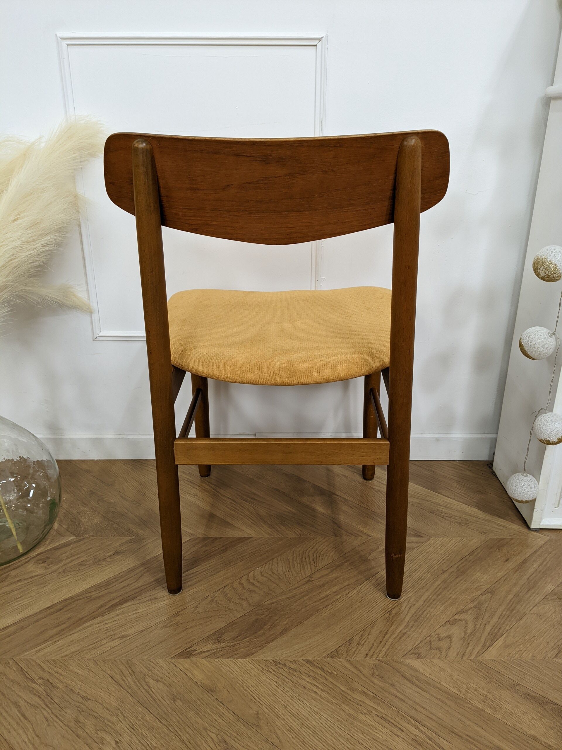 Scandinavian chair with mustard yellow fabric
