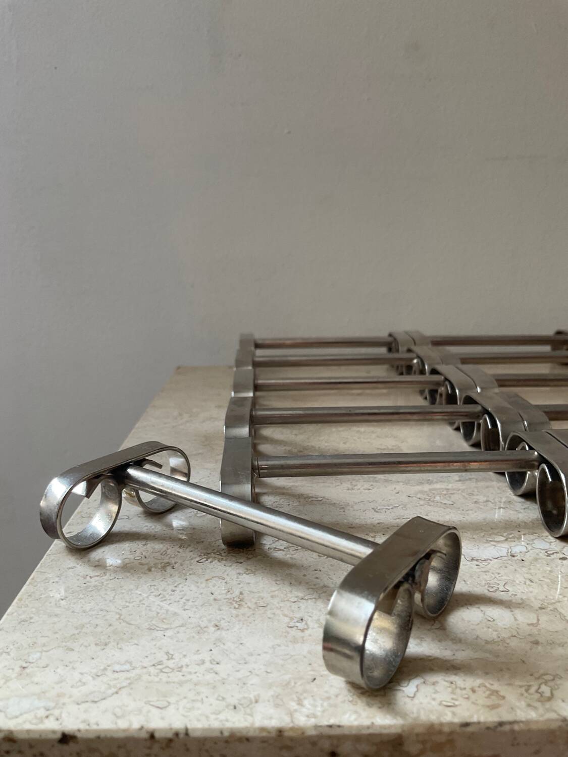Series of 12 vintage stainless steel knife holders